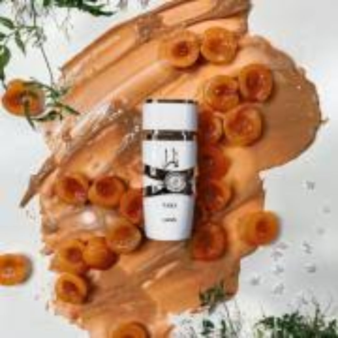 Two coffee cups on a wooden surface with a blurred background