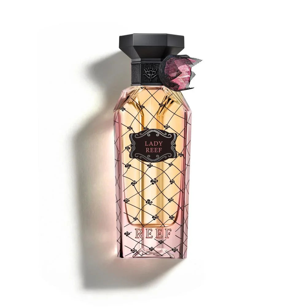 Perfume bottle labeled 'Lady Reef' with decorative cap on a white background