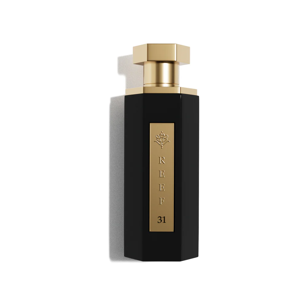 Perfume bottle with gold cap and label on a white background