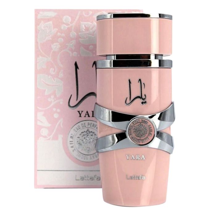 Pink perfume bottle with silver accents and matching box on a white background