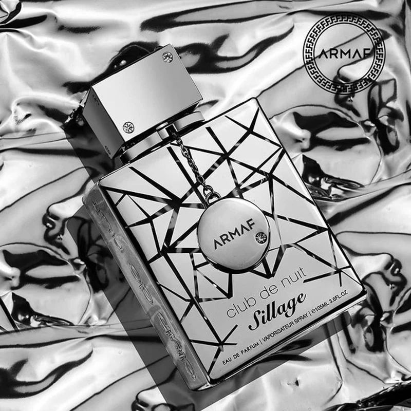 Armaf Club de Nuit Sillage perfume bottle on a reflective surface