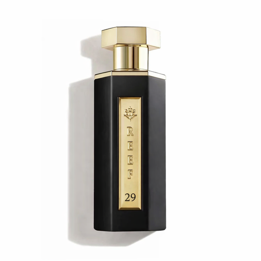 Perfume bottle with gold cap and label on a white background