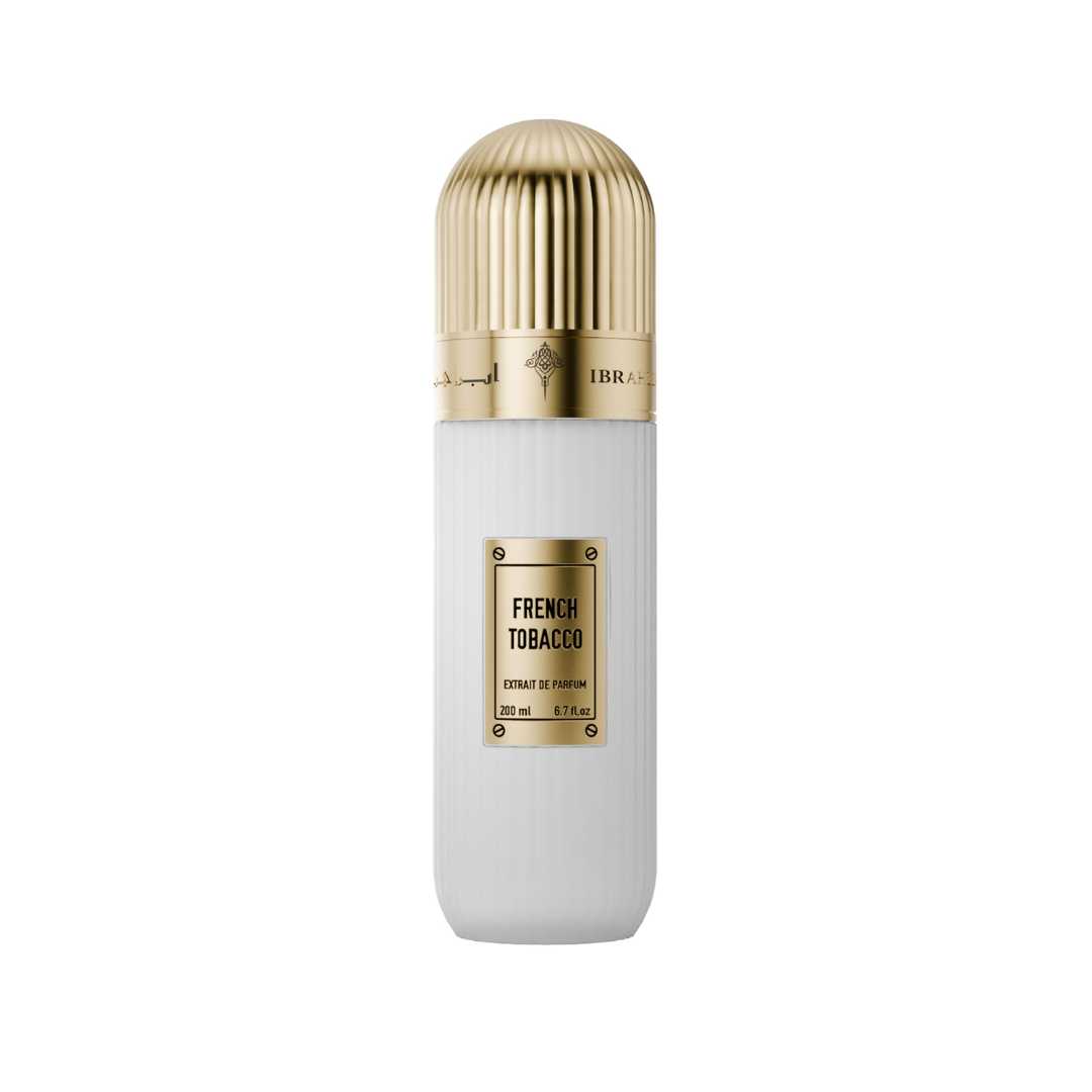 A white cylindrical perfume bottle with a ribbed gold cap and a gold label reading 'FRENCH TOBACCO' on a plain white background.