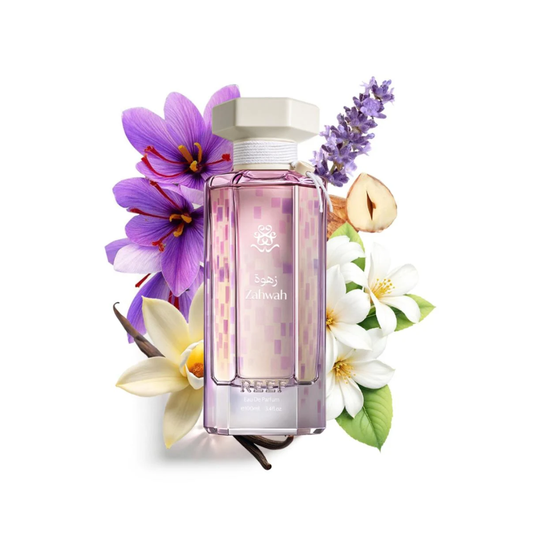 A rectangular glass perfume bottle with a pale pink patterned liquid and a white cap, surrounded by purple and white flowers with green leaves on a white background.
