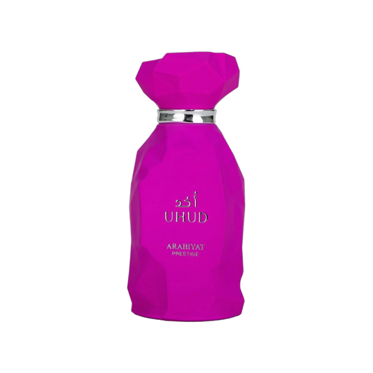 Pink perfume bottle with 'UHUD' branding on a white background