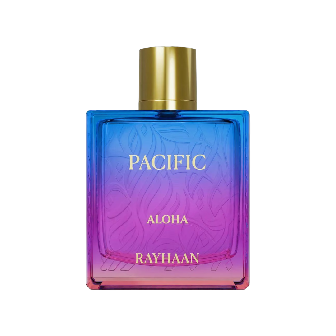 A rectangular perfume bottle with a blue-to-purple-to-pink gradient glass body, a gold cylindrical cap, and gold lettering that reads 'PACIFIC ALOHA RAYHAAN' on a white background.