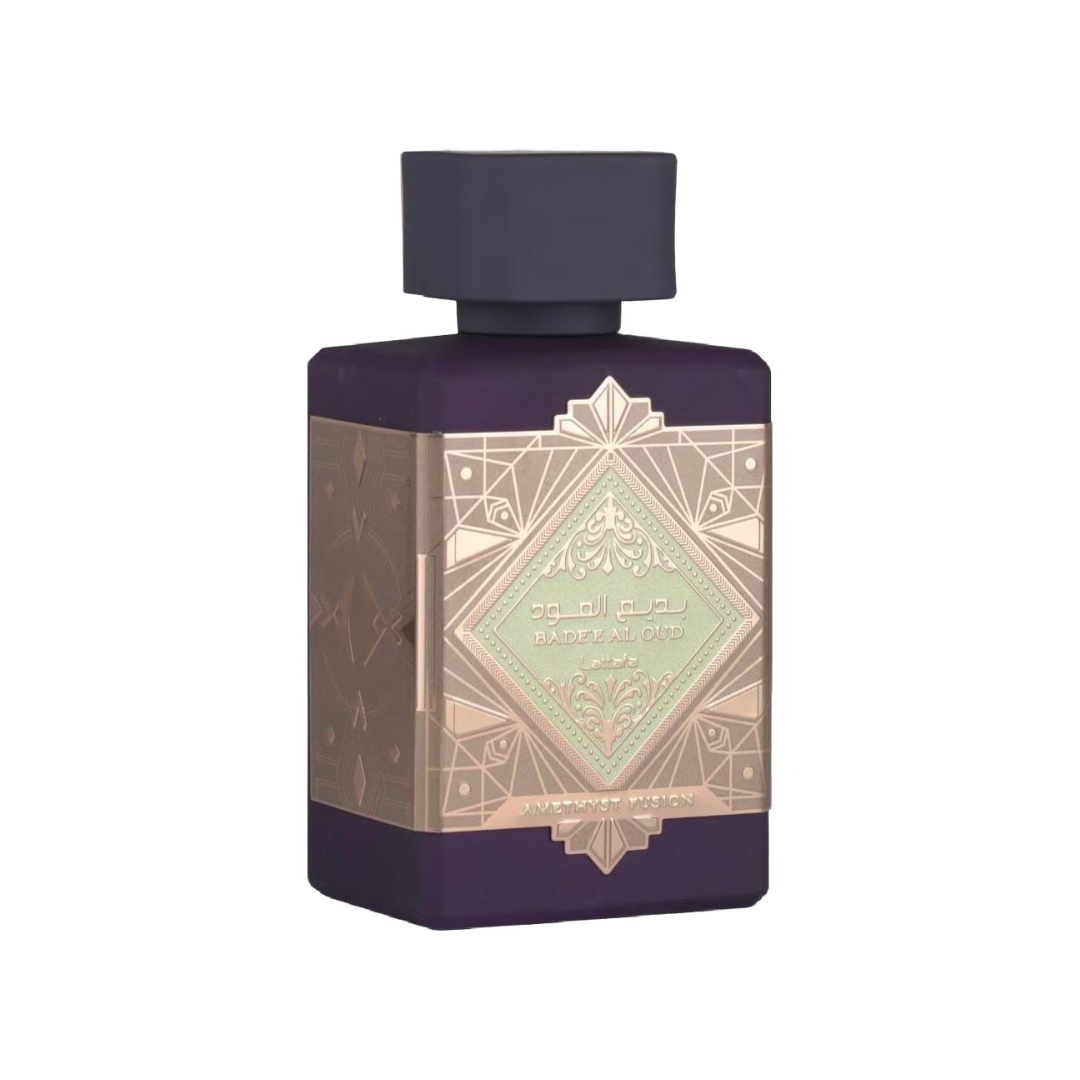 A rectangular perfume bottle with a dark purple body, a black cap, and an ornate metallic gold label featuring a central pale green diamond design.