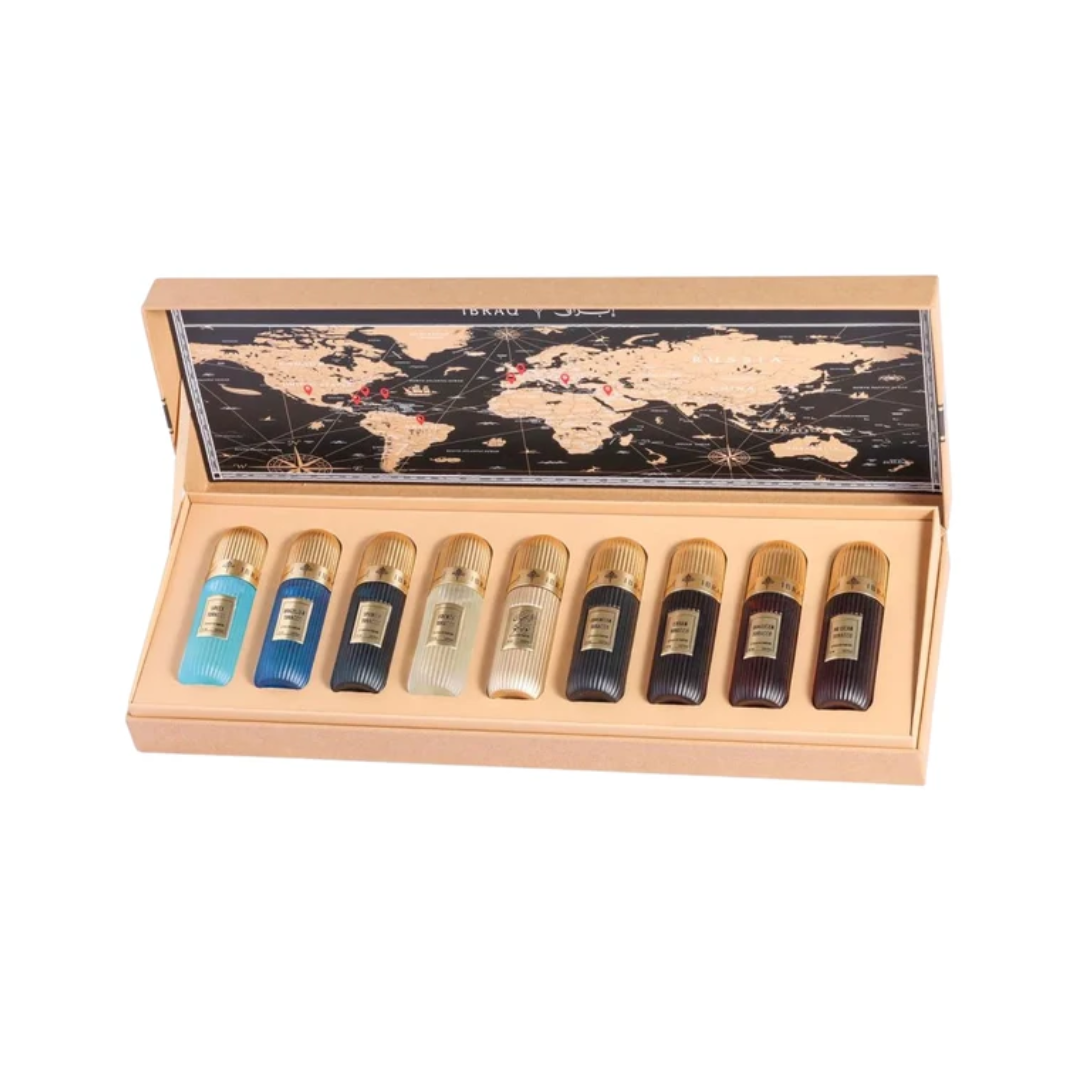 A 10-piece perfume sample set in a light wood presentation box with a world map design on the inside lid. The set includes five clear glass vials with gold caps showing light blue, blue, beige, and black liquids, and five dark brown glass vials with gold caps showing dark liquids.