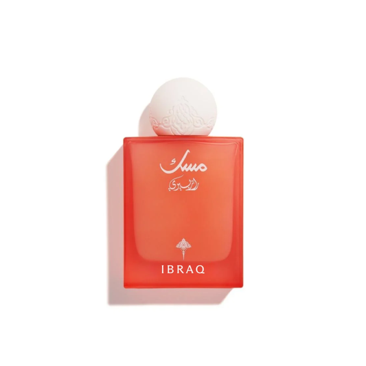 A bottle of Suo E Brumal Ibrahim perfume with a translucent orange-red rectangular glass body, a white spherical cap, and white Arabic script on the front, set against a plain white background with a soft shadow.