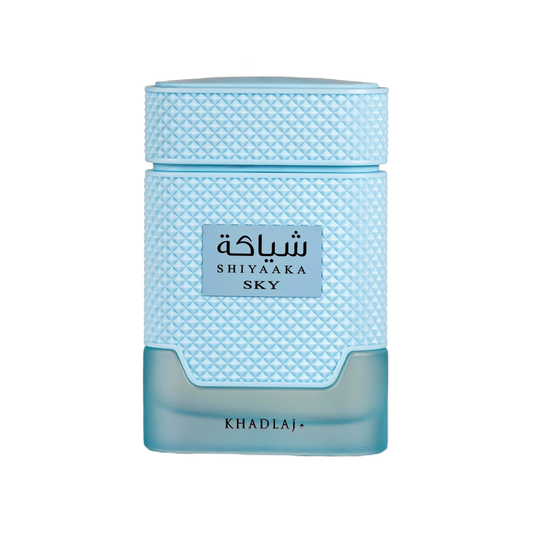 Khadlaj Shiyaka Sky perfume bottle in light blue textured glass with a matching cap, on a solid white background.
